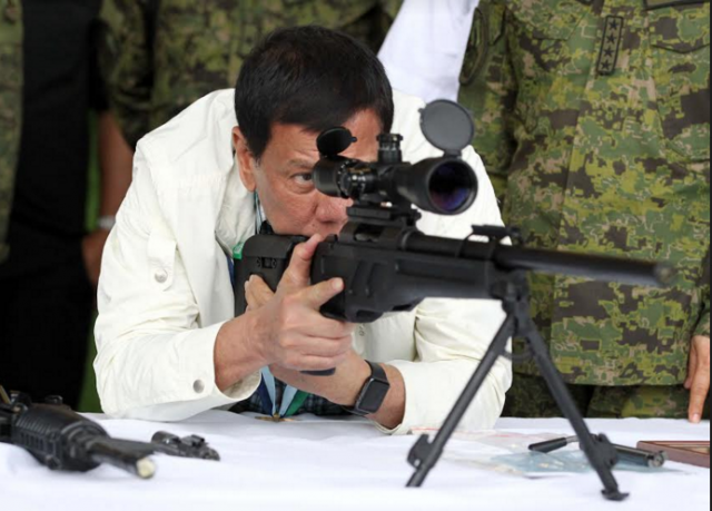 Duterte checks rifle sight
