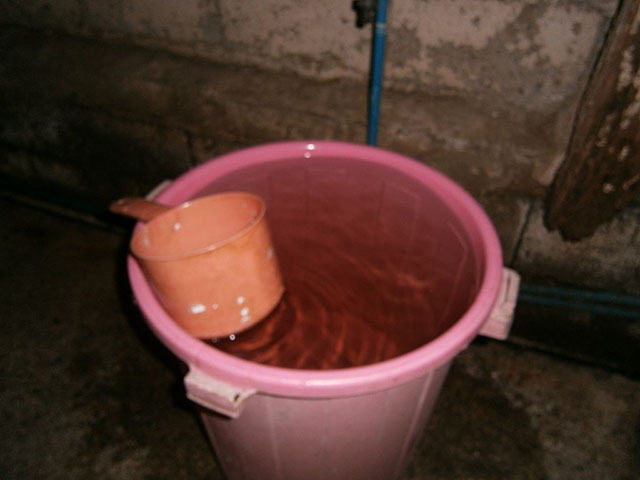 Tabo with a pail