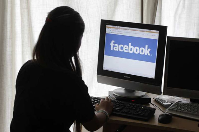 A girl accessing Facebook