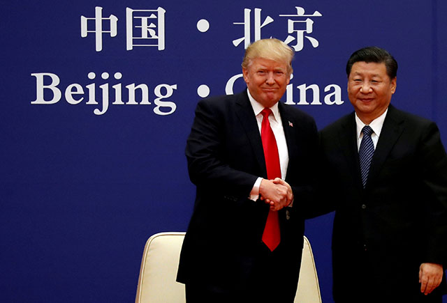 U.S. President Donald Trump and China's President Xi Jinping meet business leaders at the Great Hall of the People in Beijing