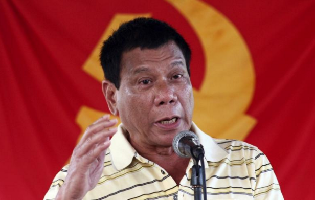 Rodrigo Duterte in front of CPP-NPA flag_Reuters file