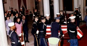 Flag-draped JFK casket