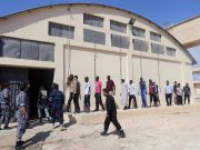 U.N. assisting thousands of migrants stranded as factions battle for Libyan smuggling hub