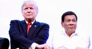 Duterte Trump hands clasp ASEAN2017