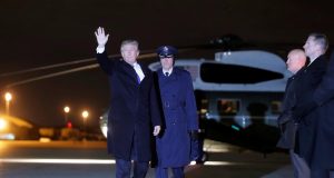 U.S. President Donald Trump waves as he boards Air Force One for travel to Switzerland to attend the World Economic Forum (WEF) annual meeting in Davos from Joint Base Andrews, Maryland, U.S.