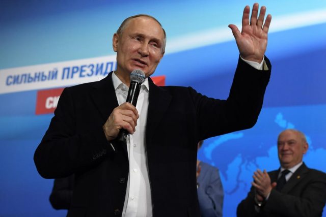 Russian President and Presidential candidate Putin speaks during a meeting with supporters at his campaign headquarters in Moscow