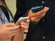 People checking smartphones