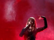 Taylor Swift kicks off American Music Awards, silent on politics