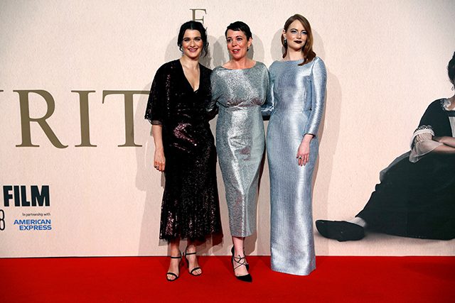 Actors Rachel Weisz, Olivia Colman and Emma Stone pose at the UK Premiere of The Favourite during the London Film Festival