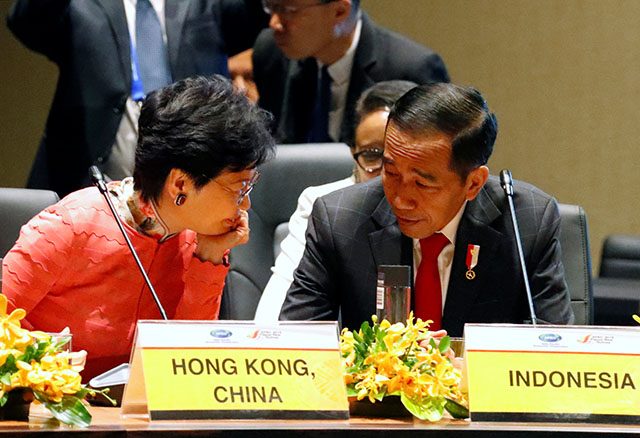 Hong Kong Chief Executive Carrie Lam talks to Indonesian President Joko Widodo at the APEC Summit, in Port Moresby
