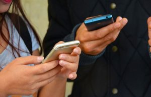 Teenagers on their smartphones