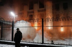 Smoke from a flare thrown by a protester