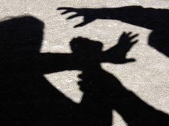 Silhouette of a woman fighting against a man