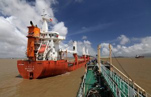 Sinopec oil tanker approaches cargo vessel Dongtai Baoze berthed at an anchorage off Zhoushan port to supply it with bunker fuel