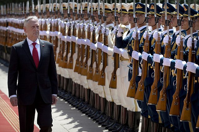 .S. Defense Secretary Jim Mattis reviews a Chinese honor guard during a welcome ceremony at the Bayi Building in Beijing