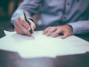Applicant writing in a form