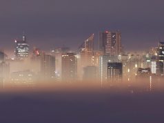 The Metro Manila skyline is seen during smog on the first break of dawn of the New Year in Antipolo City, Rizal
