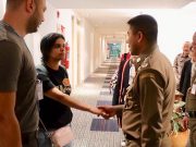 Saudi teen Rahaf Mohammed al-Qunun is greeted by Thai immigration authorities at a hotel inside Suvarnabhumi Airport in Bangkok