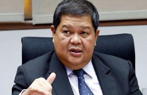 Philippine Central Bank governor Espenilla gestures during an interview with Reuters at the central bank headquarter in Pasay, metro Manila