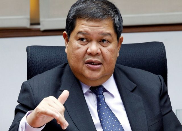 Philippine Central Bank governor Espenilla gestures during an interview with Reuters at the central bank headquarter in Pasay, metro Manila