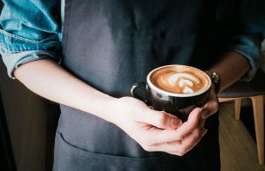 Barista with a cup