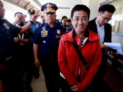 Rappler CEO and Executive Editor Ressa is escorted by police after posting bail in Pasig Regional Trial Court in Pasig City