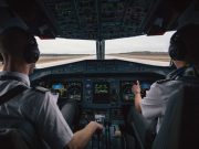 Pilot gives heartwarming surprise tribute to parents onboard flight Pilots in a cockpit
