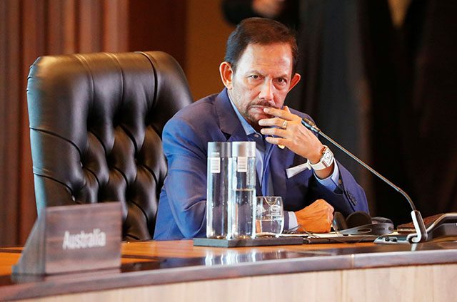 Brunei's Sultan Hassanal Bolkiah attends the retreat session during the APEC Summit in Port Moresby, Papua New Guinea