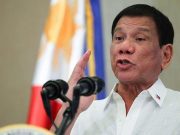 Duterte gesturing in a speech