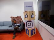 Facebook reveals how it ranks items in the news feed A man reads a newspaper at the reception area of Facebook's new office in Mumbai