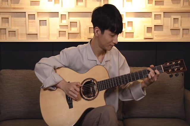 Sungha Jung with a guitar