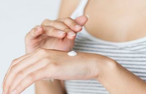 Woman applying cream