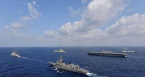 Vessels from the U.S. Navy, Indian Navy, Japan Maritime Self-Defense Force and the Philippine Navy sail in formation at sea