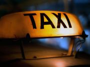Taxi driver who scammed Austrian vloggers caught by authorities Taxi sign