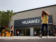 Huawei will continue security support for Android smartphones A woman looks at her phone