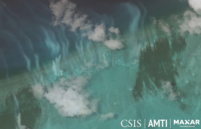 Satellite image of sediment plumes created by the activity of clam harvesting boats at Bombay Reef