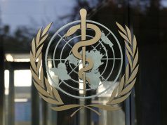 A logo is pictured on the World Health Organization headquarters in Geneva