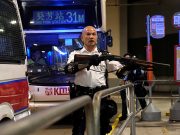 Hong Kong charges 44 protesters with rioting, grants bail A police officer points a gun during clashes with anti-extradition bill protesters who surrounded a police station where detained protesters are being held, in Hong Kong