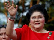 Imelda Marcos waves to the crowd