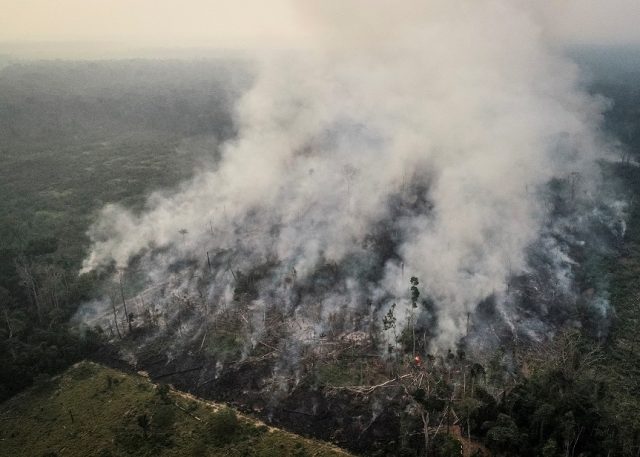 An aerial view of a tract of the Amazon jungle burning as it is being cleared by loggers and farmers in Porto Velho