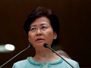 Hong Kong leader says dialogue and ‘mutual respect’ offer way out of chaos Carrie Lam on the podium