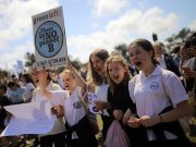 Protesters with placards participate in The Global Strike 4 Climate rally in Sydney
