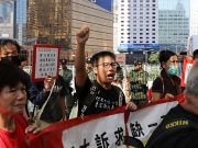 U.S. House passes legislation on Hong Kong: What does it mean? Hong Kong protester holding banners