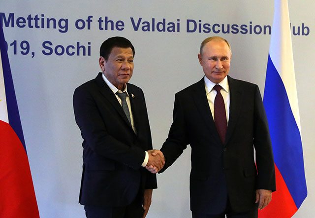 Russia's President Putin shakes hands with Philippines' counterpart Duterte during their meeting in Sochi