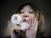 South Korea bans liquid e-cigarettes on army bases Saleswoman demonstrates vaping at Vape Shop in Beijing
