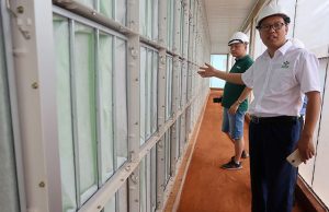Zhang Xiangjun, manager of New Hope Liuhe's Binh Phuoc pig farm, shows journalists the farm's filtering systems as part of its biosecurity measures against African swine fever disease in Binh Phuoc