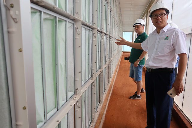 Zhang Xiangjun, manager of New Hope Liuhe's Binh Phuoc pig farm, shows journalists the farm's filtering systems as part of its biosecurity measures against African swine fever disease in Binh Phuoc