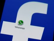 A Whatsapp icon is seen on a Samsung Galaxy S4 phone screen with a Facebook logo in the central Bosnian town of Zenica