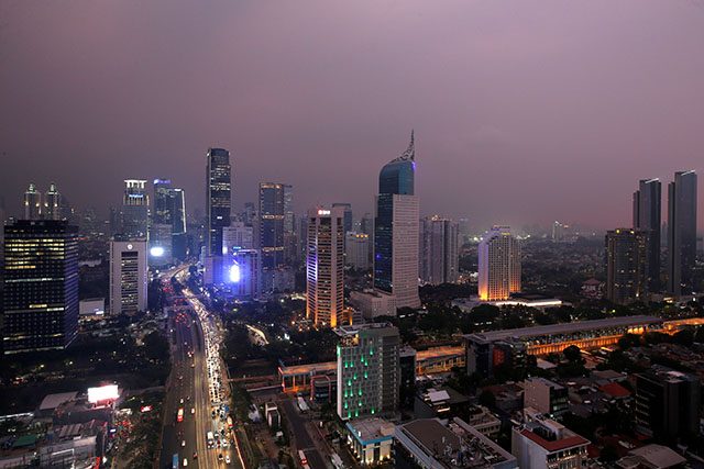 General view of a business district at sunset in Jakarta
