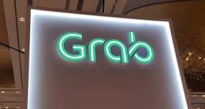 A Grab logo is pictured at the Money 20/20 Asia Fintech Trade Show in Singapore